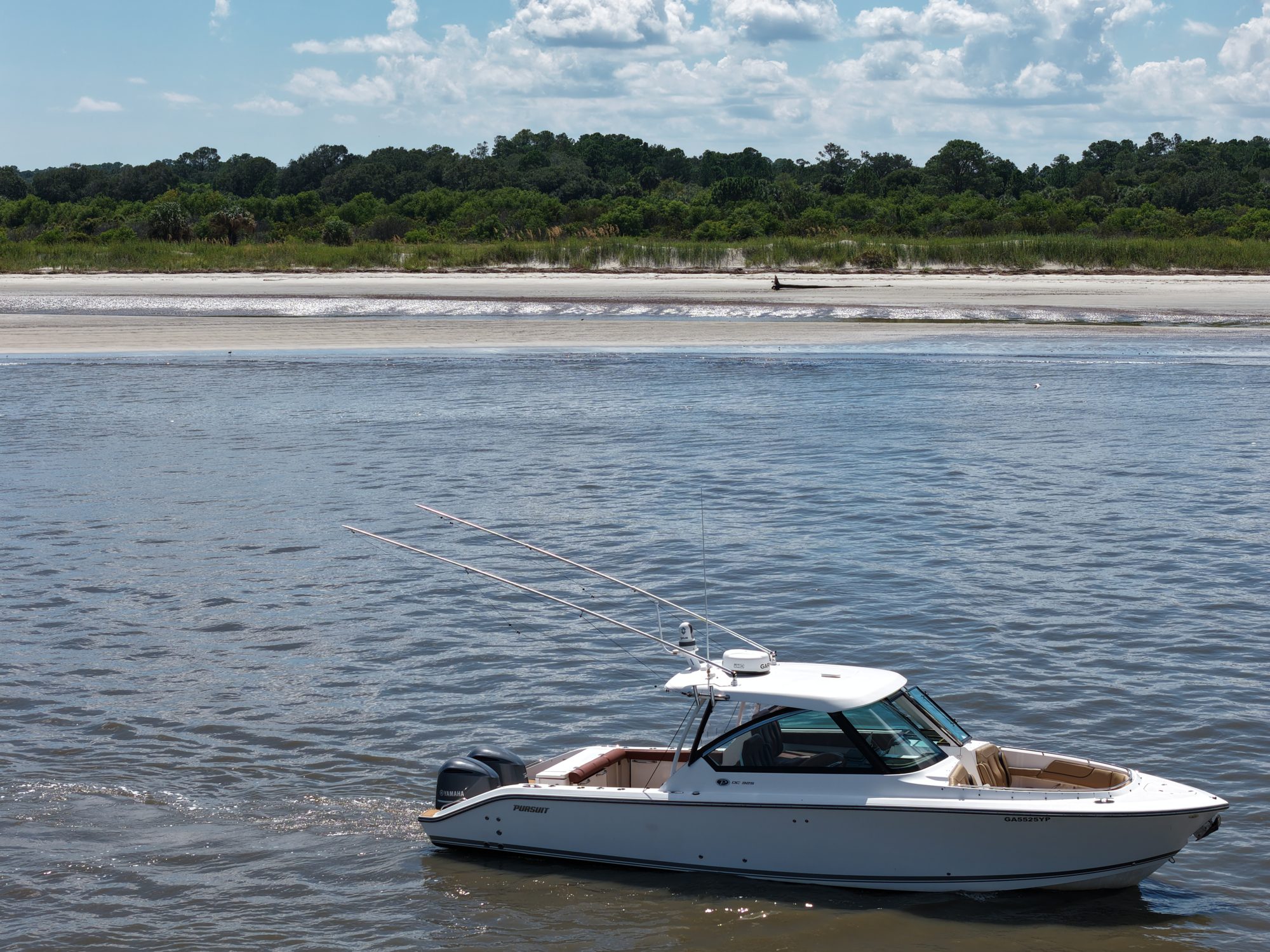 The boat anchored off a barrier island beach near Savannah